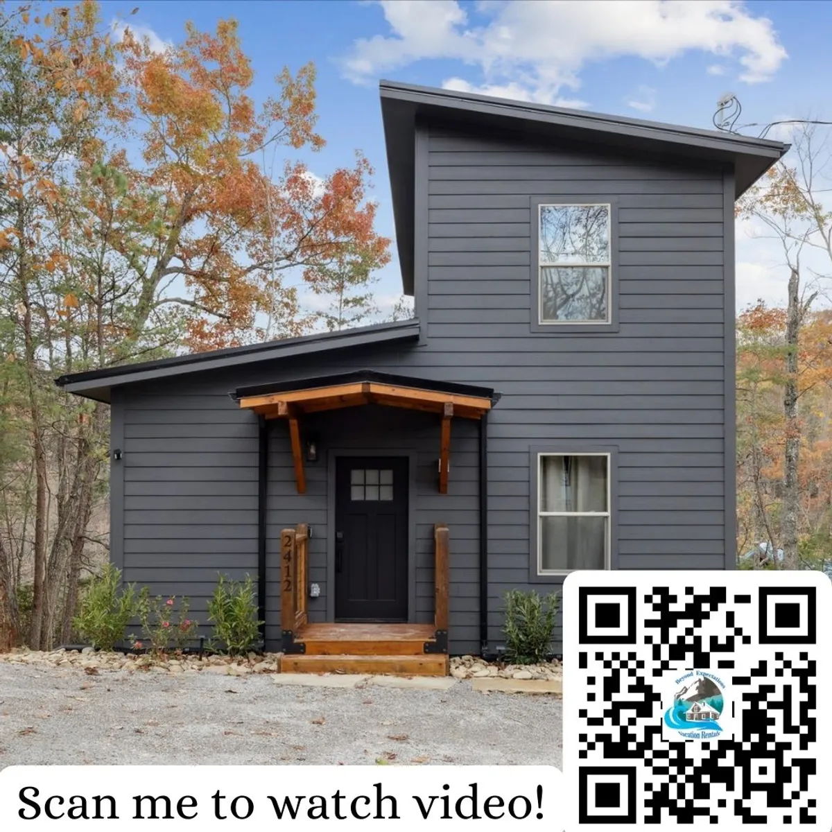 An inviting view of the cabin’s modern exterior, with a welcoming front porch and landscaped area. Family members can be seen relaxing on the porch, and the surrounding greenery hints at nearby forests and natural exploration options.